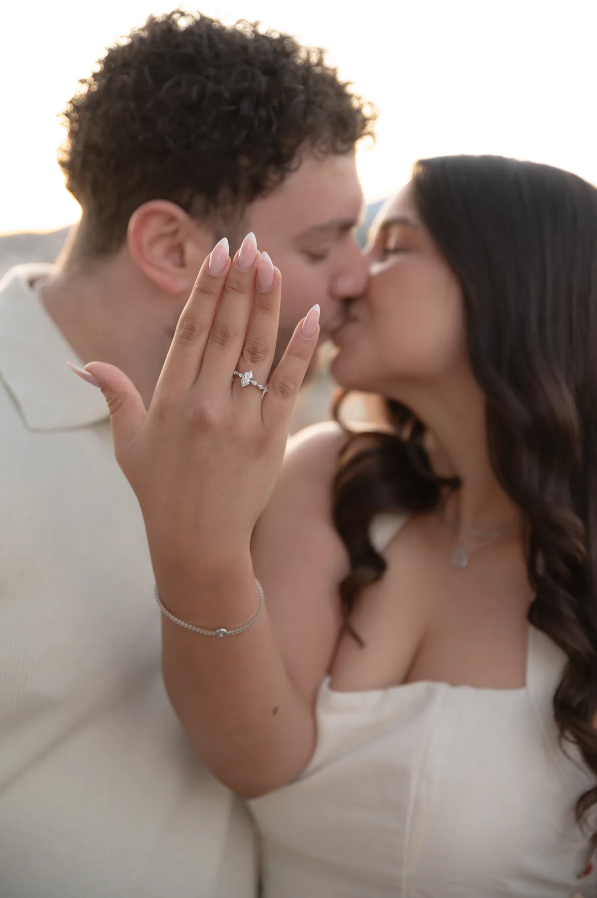 A couple after the proposal, above the bay