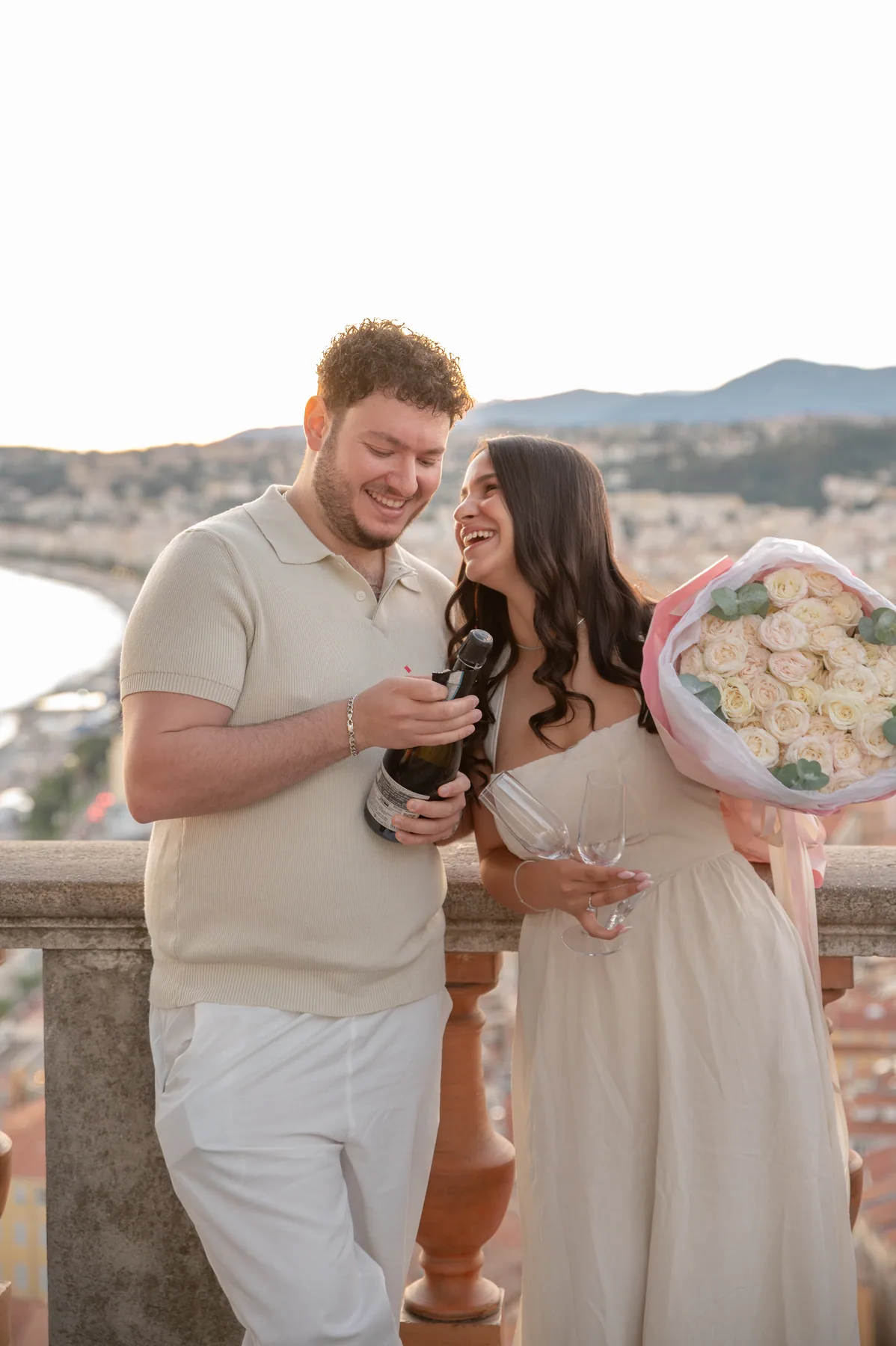 Opening champagne with a bouquet after the celebration