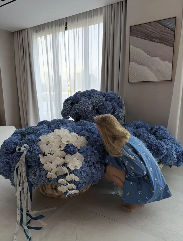 Blue hydrangeas and white roses arranged for a celebration